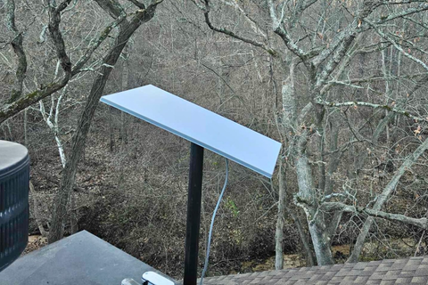 Amazon Leo terminal installed on a residential roof with clear sky access.